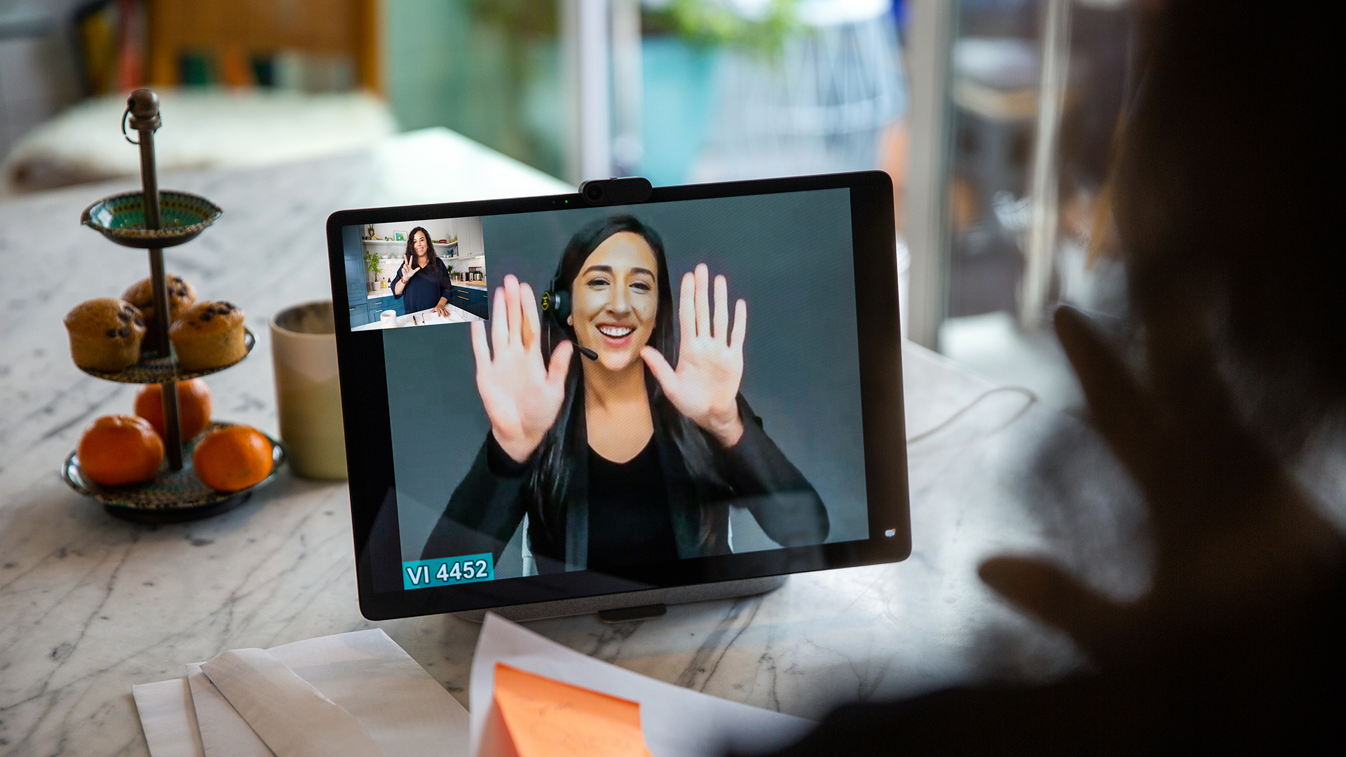 Photo of woman using Video Relay Services on Portal